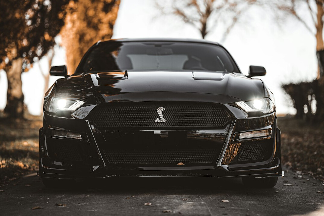 Sports car front view with polished hood